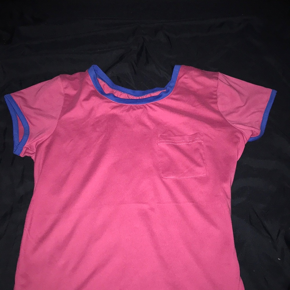 Pink shirt with blue collar and pocket
